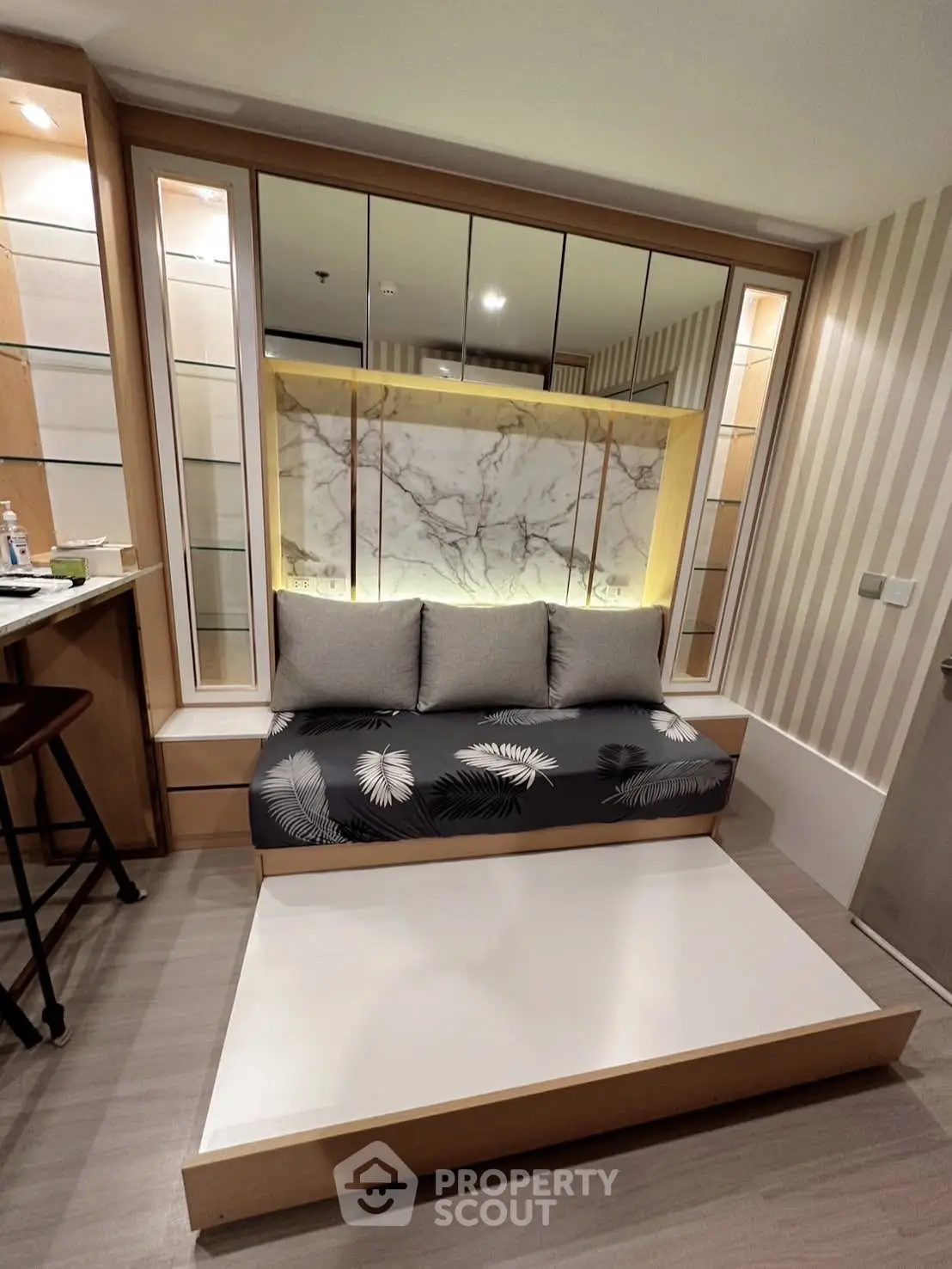 Modern living room with stylish sofa and elegant marble accent wall