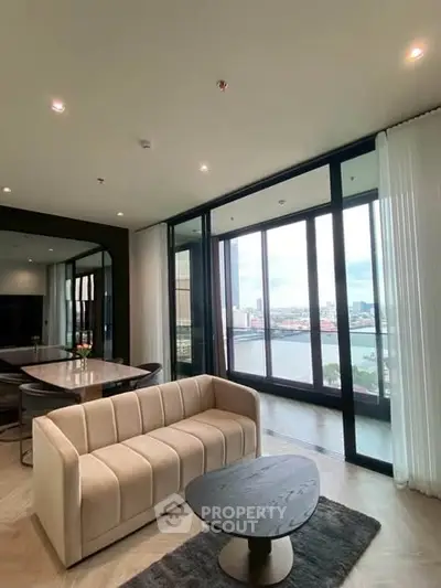 Luxurious living room with stunning river view and modern furnishings