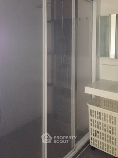 Modern bathroom with glass shower enclosure and sleek design