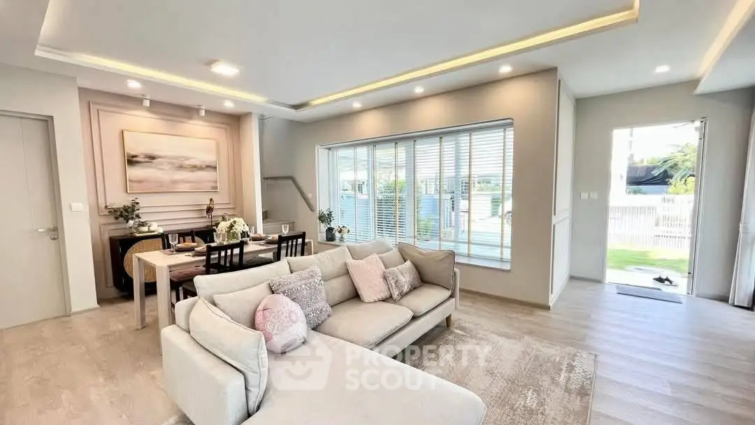 Spacious modern living room with elegant decor and natural light