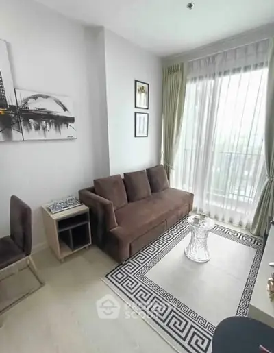 Modern living room with stylish decor and large window for natural light