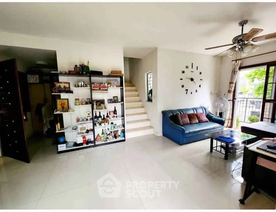Spacious living room with modern decor and natural light