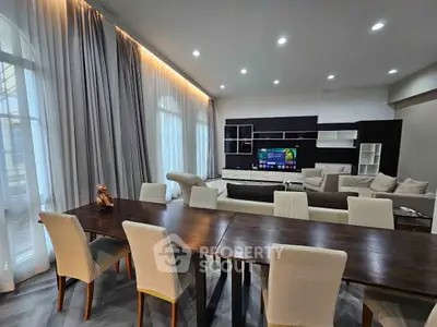 Spacious modern living room with elegant dining area and stylish decor