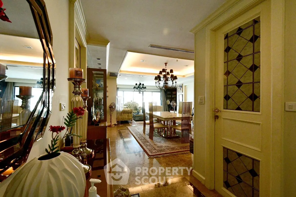 Luxurious living and dining area with elegant decor and marble flooring