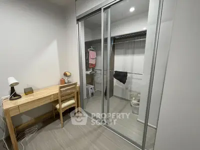 Modern study room with sliding closet doors and wooden desk