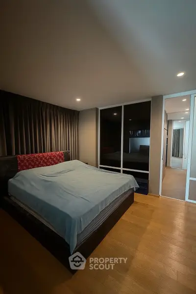 Spacious bedroom with modern design and cozy ambiance