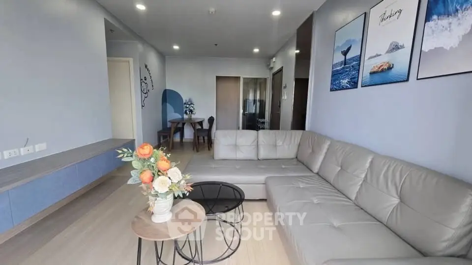 Modern living room with stylish decor and comfortable seating in a contemporary apartment.