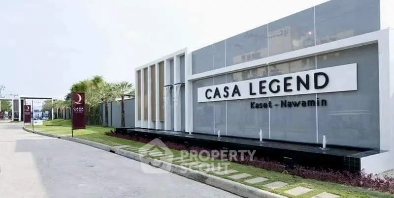 Modern entrance of Casa Legend Kaset Nawamin with sleek design and lush landscaping.