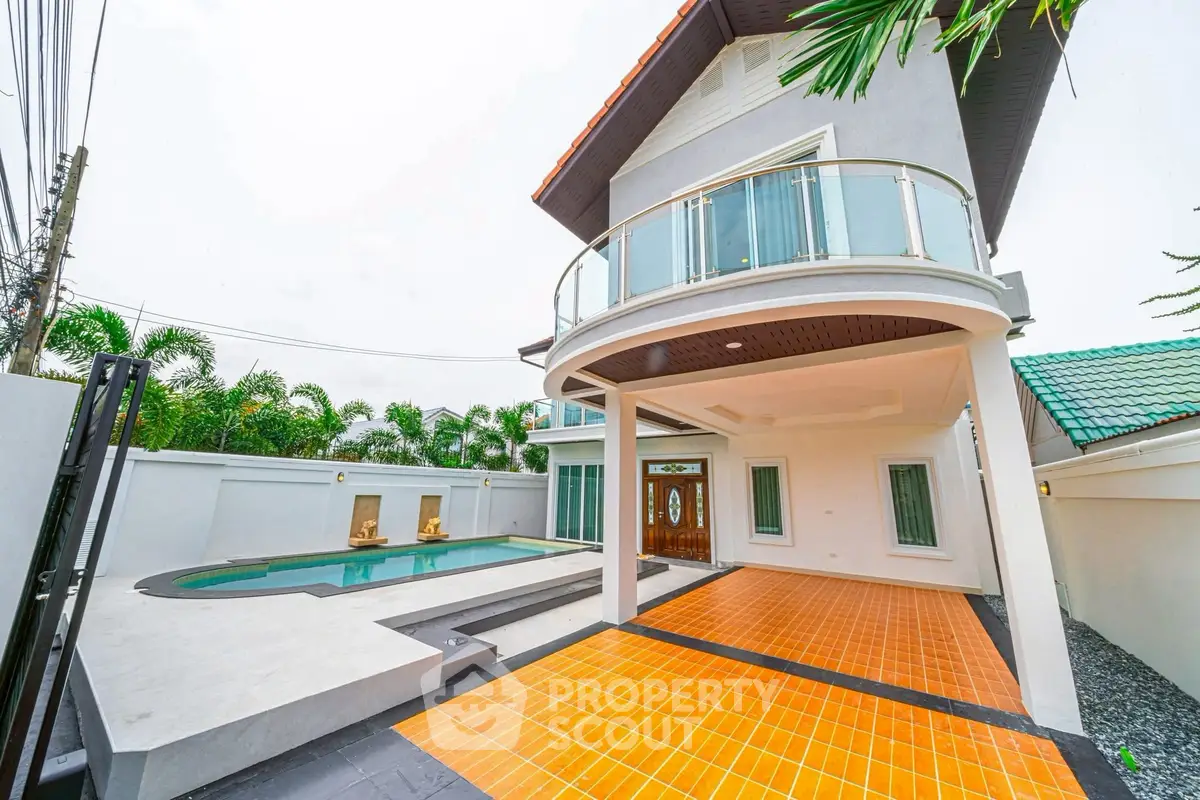 Stunning modern home with pool and spacious balcony, perfect for luxury living.