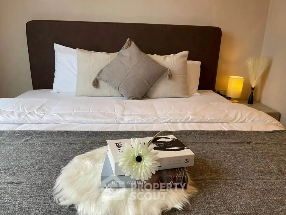 Cozy bedroom with stylish decor and plush bedding, perfect for relaxation and comfort.