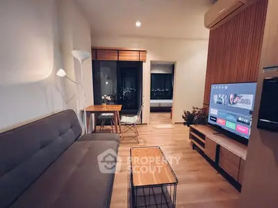 Modern living room with stylish furniture and city view, perfect for urban living.