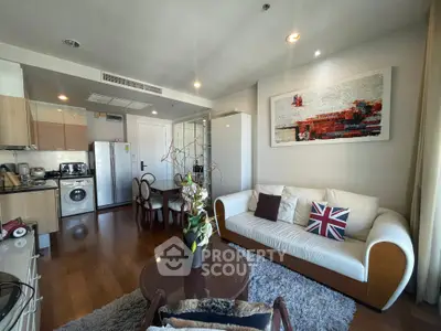 Stylish open-plan living room with modern kitchen and cozy seating area, perfect for urban living.