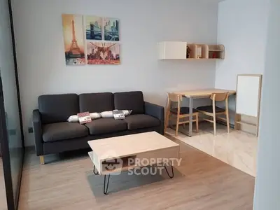 Modern living room with stylish furniture and wall art, perfect for cozy gatherings.