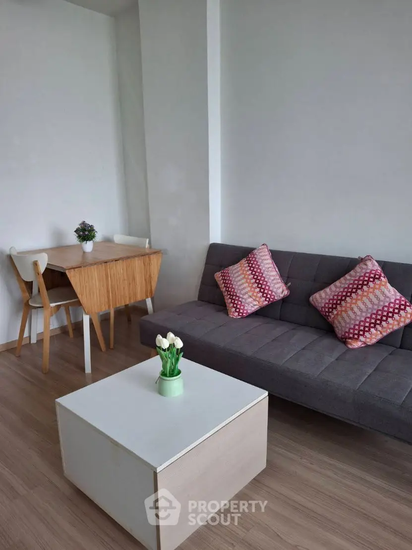 Modern living room with stylish furniture and cozy decor, perfect for relaxation and entertaining.