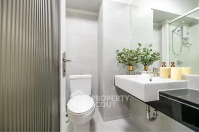 Modern bathroom with sleek design and elegant fixtures, perfect for contemporary living.