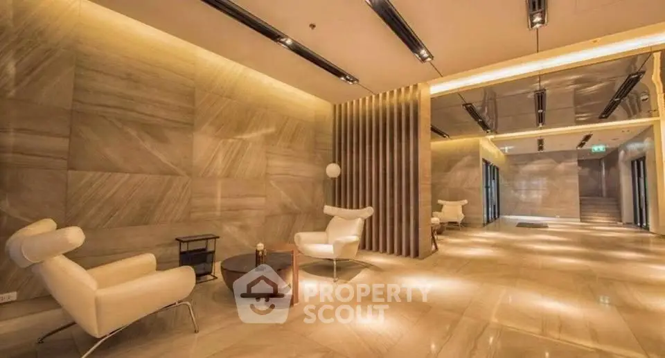 Luxurious modern lobby with elegant seating and ambient lighting in a high-end building.