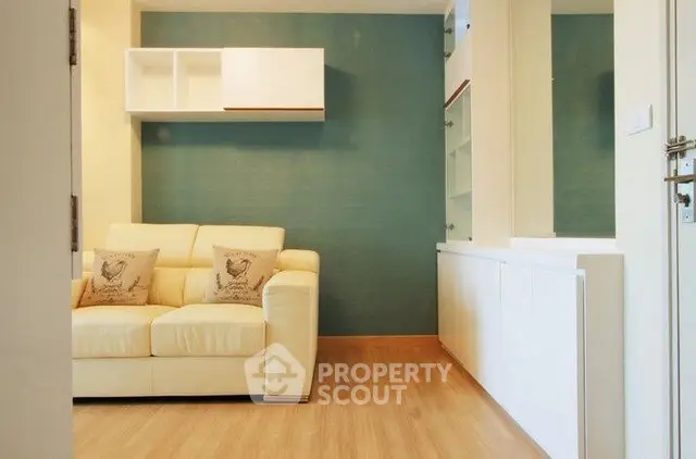 Modern living room with stylish sofa and wooden flooring in a cozy apartment.