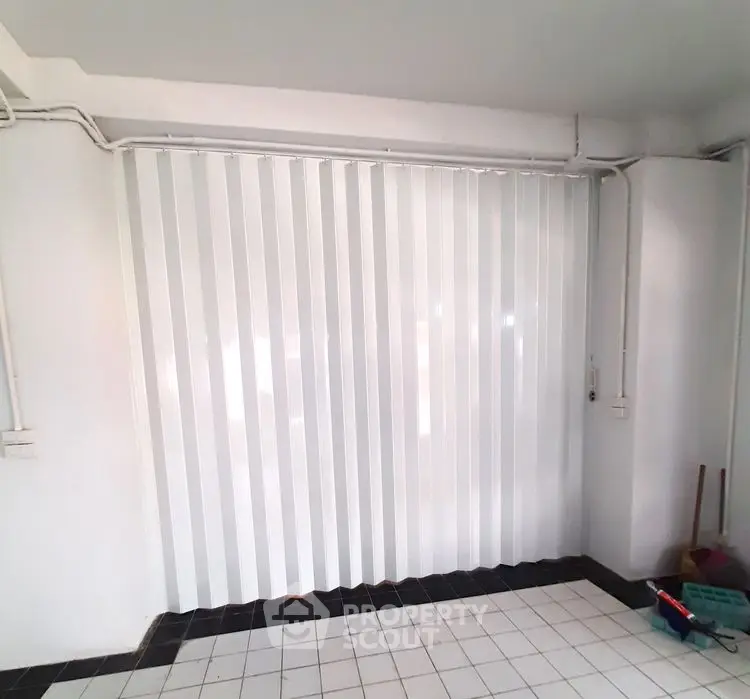 Spacious storage area with sliding door in modern building