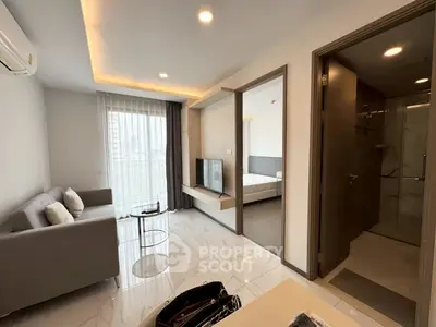 Modern apartment interior with open living room and bedroom view