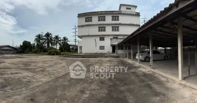 Spacious property with ample parking and unique architectural design, ideal for commercial or residential use.