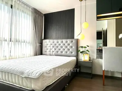 Modern bedroom with stylish decor and ample natural light