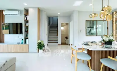 Modern open-plan living room with stylish decor and dining area