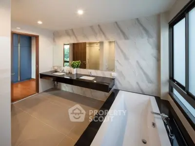 Luxurious modern bathroom with elegant fixtures and spacious design
