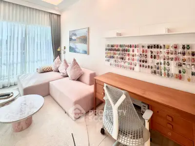 Stylish living room with modern decor and natural light, featuring a cozy sofa and elegant desk setup.