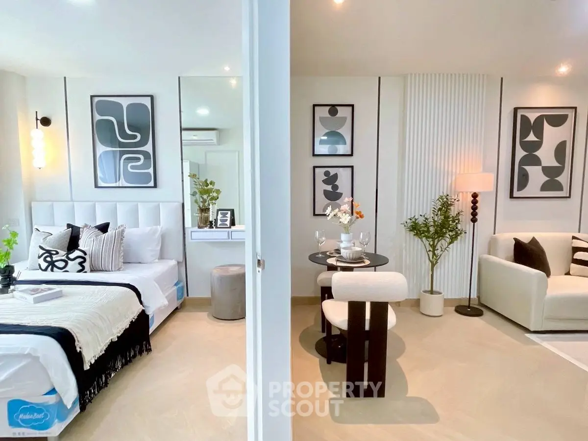 Modern open-concept living and bedroom space with stylish decor and neutral tones