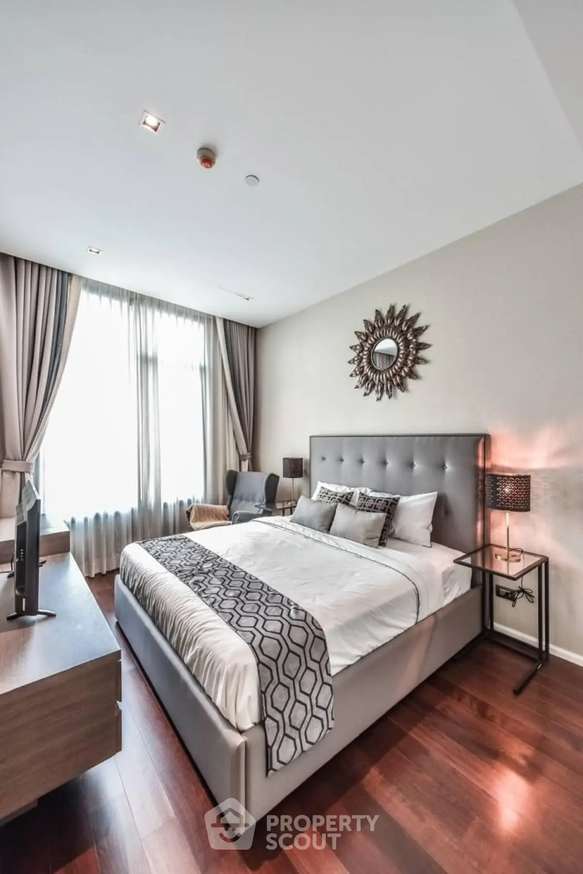 Luxurious bedroom with elegant decor and natural light