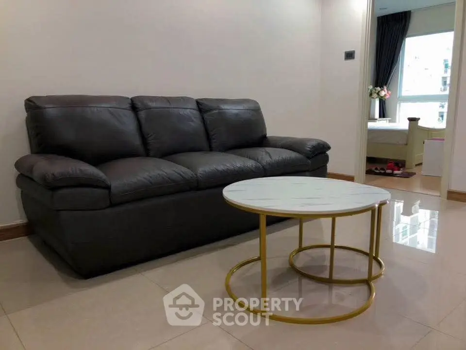 Modern living room with sleek leather sofa and stylish coffee table