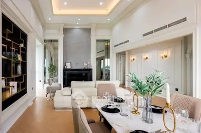 Luxurious living room with elegant dining area and modern decor