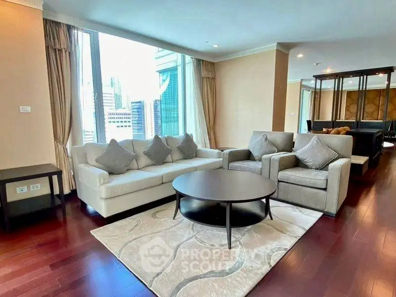 Luxurious living room with city view, elegant furniture, and hardwood floors in a high-rise apartment.