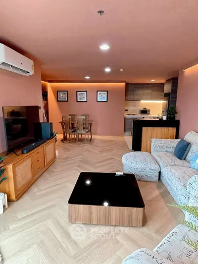 Spacious modern living room with stylish furniture and open kitchen layout