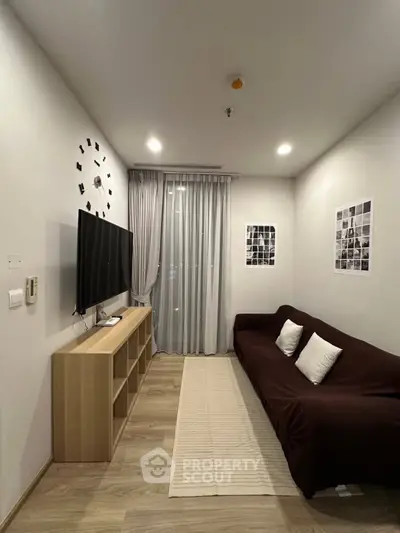 Modern living room with wall-mounted TV and stylish decor