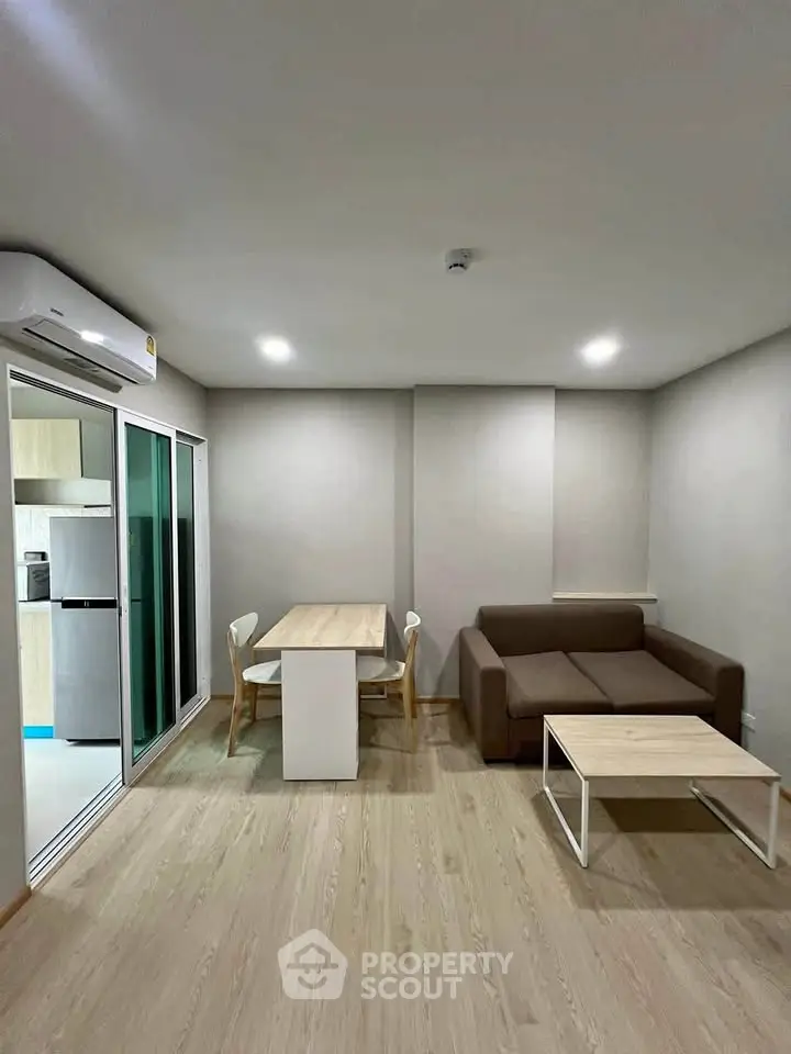 Modern living room with sleek furniture and open layout in a stylish apartment.