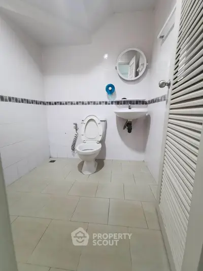 Spacious bathroom with modern fixtures and minimalist design