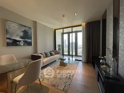 Modern living room with large windows and stylish decor in a high-rise apartment.