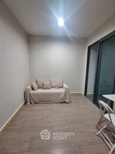Cozy small living room with minimalist decor and natural light