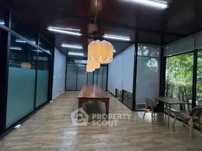 Spacious modern study room with elegant lighting and large windows