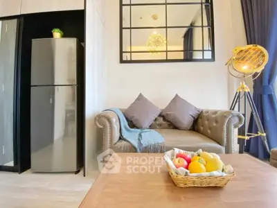 Chic living room with modern decor, plush sofa, and stylish lighting in a cozy apartment setting.