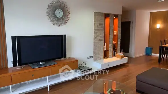 Modern living room with stylish decor and wooden flooring