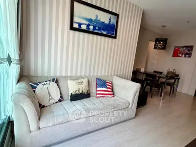 Stylish living room with modern decor and cozy seating in a contemporary apartment.