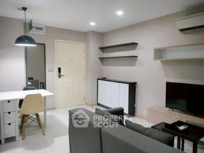 Modern living room with sleek furniture and wall-mounted shelves