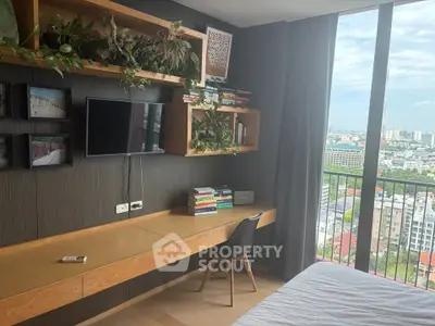 Modern bedroom with built-in desk and city view from large window