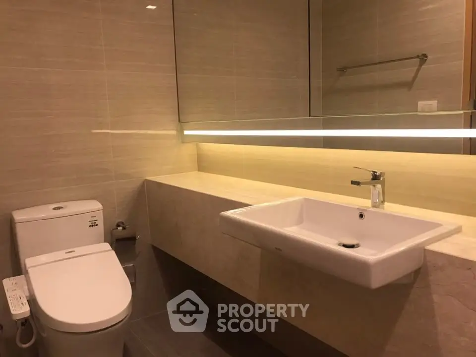 Modern bathroom with sleek fixtures and ambient lighting