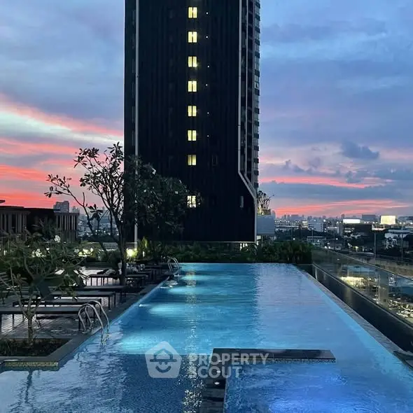 Stunning rooftop pool with breathtaking city skyline view at sunset