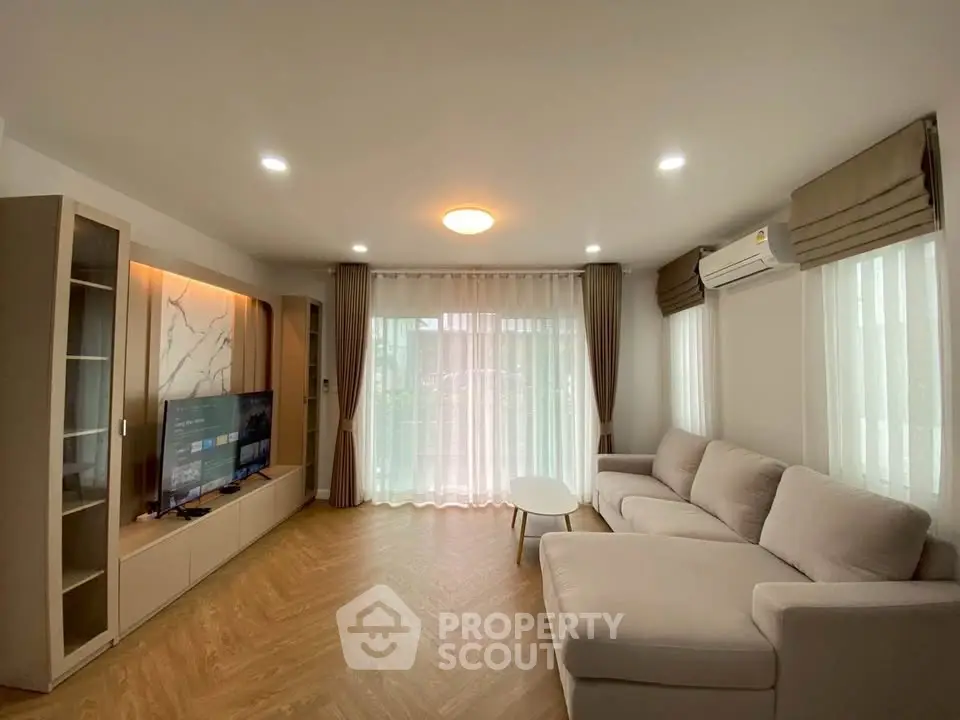 Spacious modern living room with elegant decor and natural light