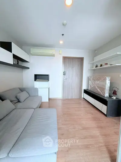 Modern living room with sleek furniture and wooden flooring