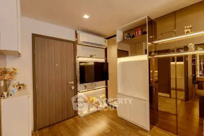 Modern living room with sleek design, wooden flooring, and stylish decor elements.